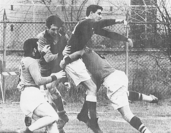 Warren Sublette, Mike Burrows, and Robbie Burnette take care of a Toronto player.